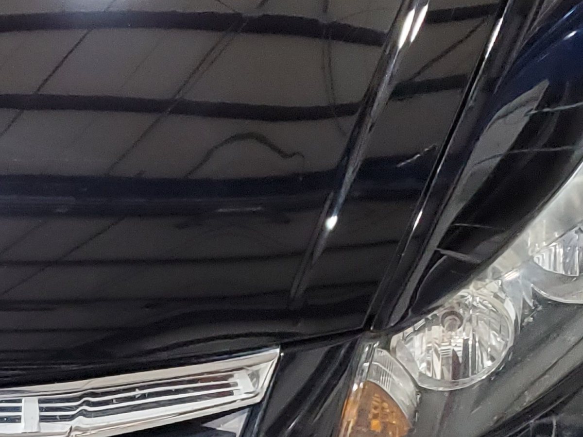 The same Honda Accord after repair, the bumper and fender straight and the paint matched.